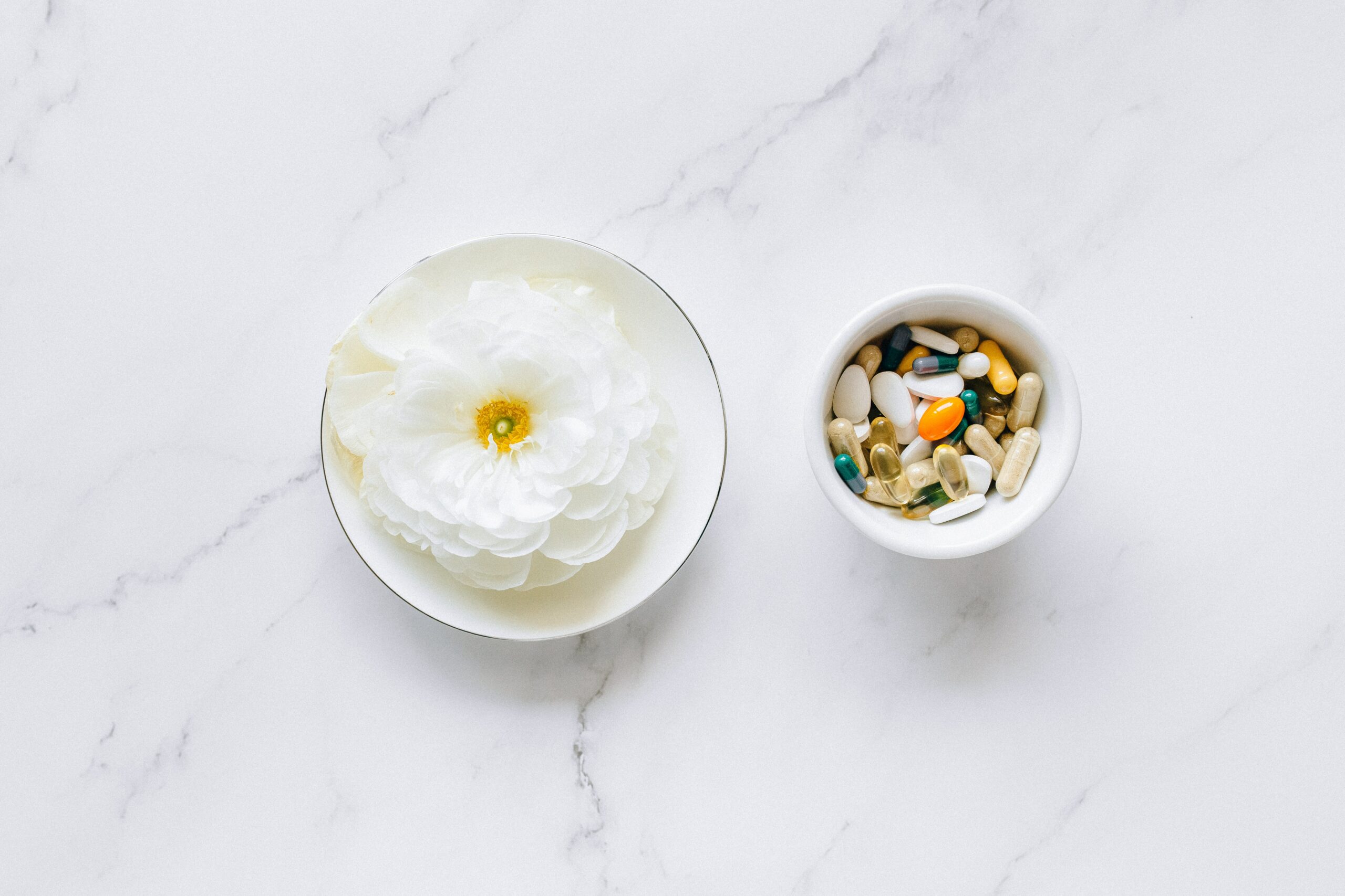 white-flower-pills-in-cup